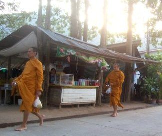 Buddhist monks on alms round in Thailand