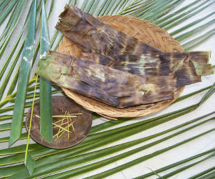 Coconut leaves made into a basket and pins