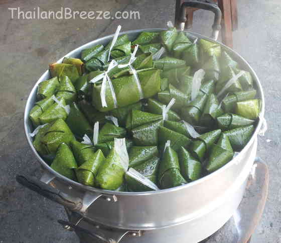 Steaming kao tom mud wrapped in banana leaf in Thailand.