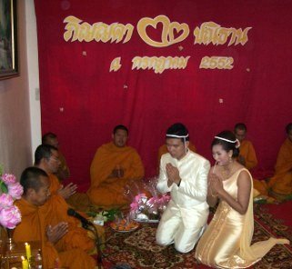 Buddhist monks chanting at a wedding ceremony in Thailand